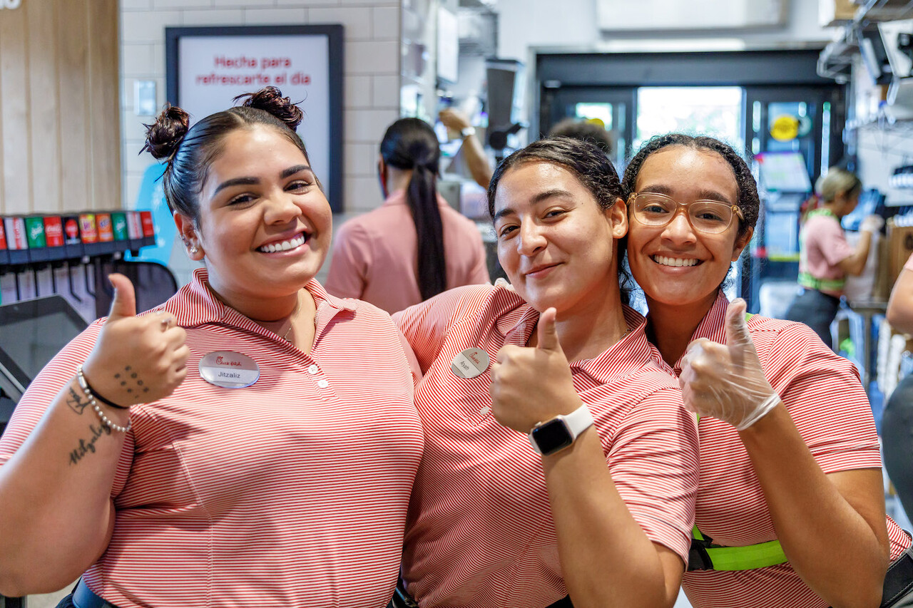 Three female Team Members smiling in the restaurant